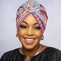 Close-up of floral knotted turban featuring ethnic geometric patterns in vibrant colors - Light Purple