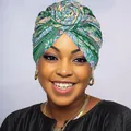 Detailed view of African ethnic style floral turban with 3D rose knot and vibrant colors - Light Green