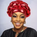 Macro view of bright red metallic braided turban cap showing luxury fabric texture - Burgundy