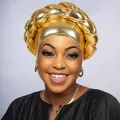 Detailed view of gold metallic braided turban cap with oversized thick twist design - Gold