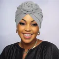 Detail view of a gray turban hat featuring a handcrafted knit twist knot for women - One Size / Gray