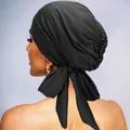 Elegant black satin turban headwear with adjustable bow tie and pleated texture detail - Black