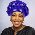 Close-up of a shiny purple metallic turban with an oversized braided design and glossy finish - Sapphire Blue
