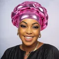 Close-up of pink metallic turban with twisted braid design and glossy texture finish - Dusty Rose