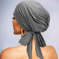 Close-up of grey ruched turban with silk-like sheen and elegant back bow tie detail - Dark Gray