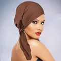 Close-up detail of smooth dark brown elastic turban hat fabric with a stylish knot design - One Size / Coffee