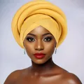 Close-up of bright yellow twisted African turban headwrap with layered sponge detailing - Ginger Yellow