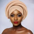 Close-up of beige layered sponge twist turban with structured multi-ring African style wrap - Khaki