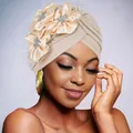 Detail of beige pleated turban with satin flowers, silver rhinestones and black mesh veil - Beige
