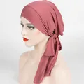 Close-up of pink ribbed turban fabric detail showing cross-tie texture and stitching - One Size / Bean Paste Red