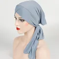 Detailed view of the ribbed fabric and cross-front knot design on the blue turban cap - One Size / Blue Gray