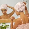 Detail view of pink checkerboard waterproof shower cap with soft satin lining in bathroom - Double-Layer Lightweight Khaki Plaid
