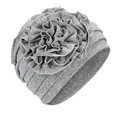 Close-up of a grey stretch turban hat featuring a large layered ruffle flower detail - One Size / Light Gray