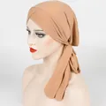 Detail showing cross-front knot and ribbed texture of an apricot stretch turban wrap - One Size / Khaki