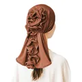 Detail view of the elegant dark brown turban hat featuring a 3D layered floral design on back - Coffee