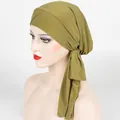 Detail showing crossover front and long ties on ribbed olive green knit turban cap - One Size / Matcha Green