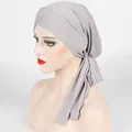 Detail showing the gray ribbed fabric and adjustable cross strap design of the turban hat - One Size / Light Gray