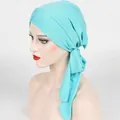 Detail of mint green turban hijab showing ribbed knit texture and layered cross knot design - One Size / Light Green