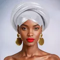 Detail of silver pleated African Gele turban and large layered gold disc earrings - White