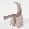 Close-up of taupe elastic hijab with metallic snap buttons for secure adjustable styling - Light Gray