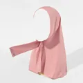 Detail view of the adjustable snap buttons and elastic knit fabric on the mauve hijab - Pink