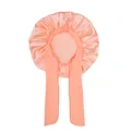 Detailed view of pink satin hair sleep bonnet with long adjustable ribbons and ruffle edge - Champagne