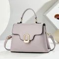 Detail view of light purple litchi grain leather texture and golden metal buckle - Taro Purple