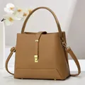 Large capacity tan litchi pattern bucket bag with golden hardware and shoulder strap - Khaki
