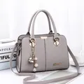 Elegant light grey PU leather handbag with floral pearl charm and gold hardware accent - Light Gray