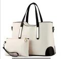 Beige faux crocodile skin tote bag with black handles and matching clutch pouch set - White
