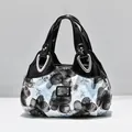 Fashionable floral print handbag with black patent leather handles and silver hardware - Black - Dream Blue Floral