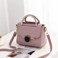 Pale purple lychee pattern leather handbag with gold metal handle and black lock decoration - Taro Purple