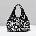Fashionable women's tote bag with black and white zebra print and silver hardware - Zebra Print