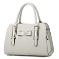 Elegant ivory quilted handbag with a bow accent and gold hardware on white background - Off White