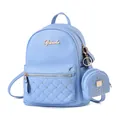 Close-up of light blue pebbled leather backpack with gold rivets and round coin purse - Sky Blue