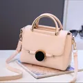 Elegant apricot pink crossbody bag with lychee texture and round gold buckle - Beige