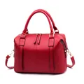 Classic red Boston handbag in textured leather with top handles and golden hardware - Burgundy