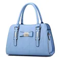 Light blue lady handbag featuring geometric triangle texture and bow decoration - Sky Blue