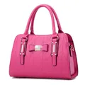 Hot pink PU leather handbag featuring geometric triangle quilting and a sweet bow accent - Rose Red