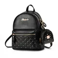 Fashionable black pebbled leather backpack with gold rivets and quilted diamond pattern - Black