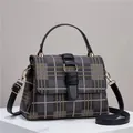 Retro glen plaid crossbody bag with yellow stitching and gold metal hardware - Black