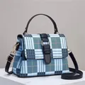 Structured blue and white checkered handbag with gold metal ring clasp and top handle - Blue