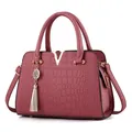Classic dark red handbag with crocodile pattern and golden V-shaped hardware detail - Pink