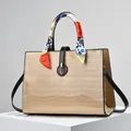 Chic beige crocodile embossed tote bag with colorful silk scarf handle and gold hardware - Khaki