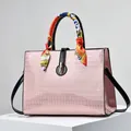 Pink embossed crocodile texture handbag with silk scarf handle and gold lock - Pink