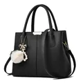 Black litchi grain leather handbag with gold hardware and plush ball charm decoration - Black