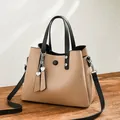 Fashionable khaki PU leather handbag with black handles and detachable shoulder strap - Khaki