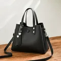 Black matte PU leather crossbody bag with silver rivets and double heart charms - Black