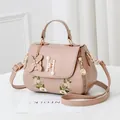 Pink crossbody bag with floral embroidery and elegant pearl clasp for women - Khaki