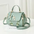 Chic mint green embroidered shoulder bag with pearl H buckle and floral charm detail - Green